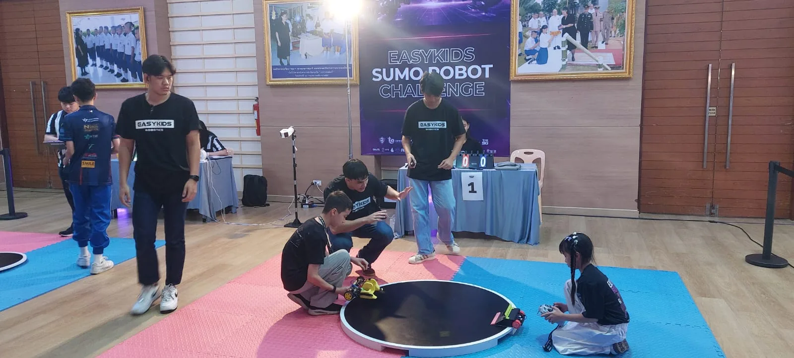 Robots and competitors at the EasyKids sumo robot challenge