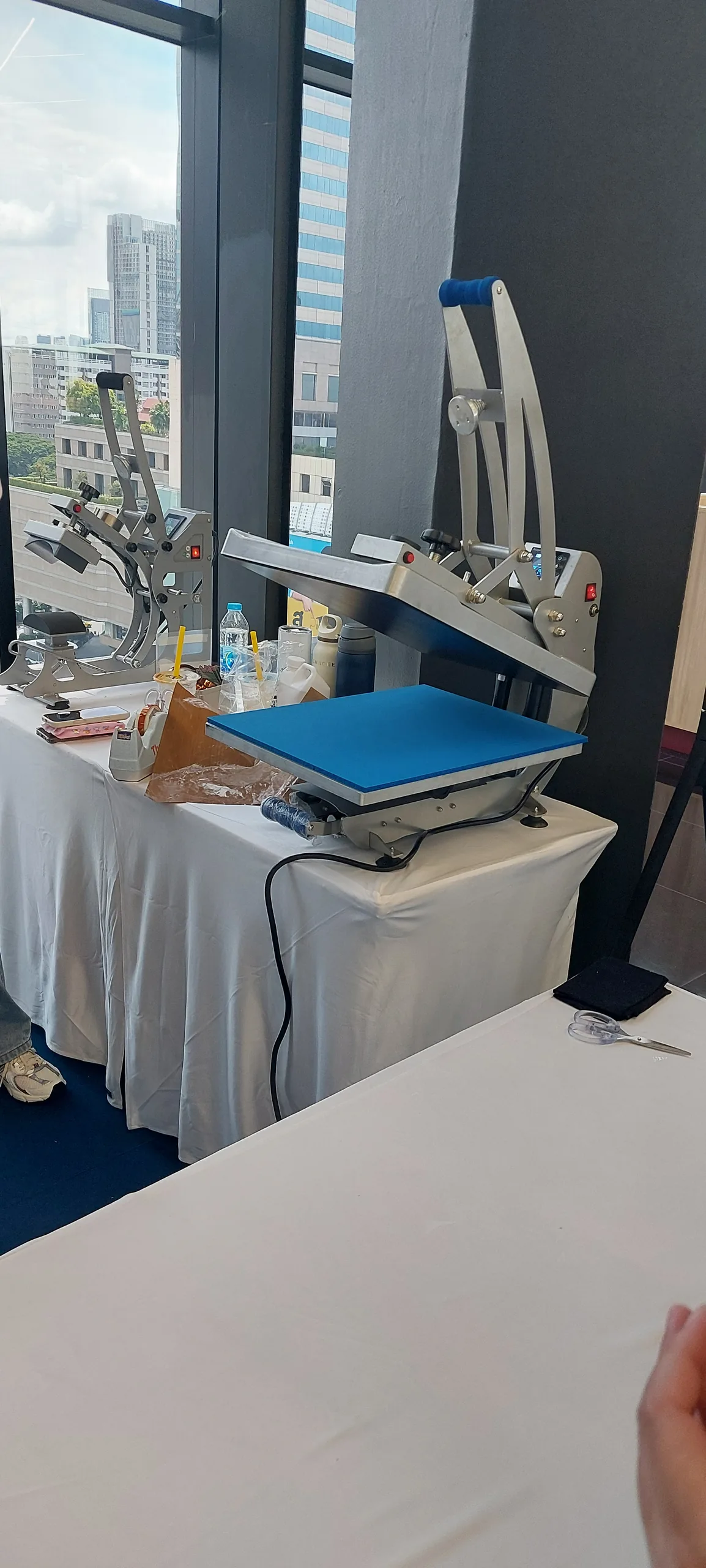 Heat-press equipment used for personalized Monsnatch merchandise in Bangkok