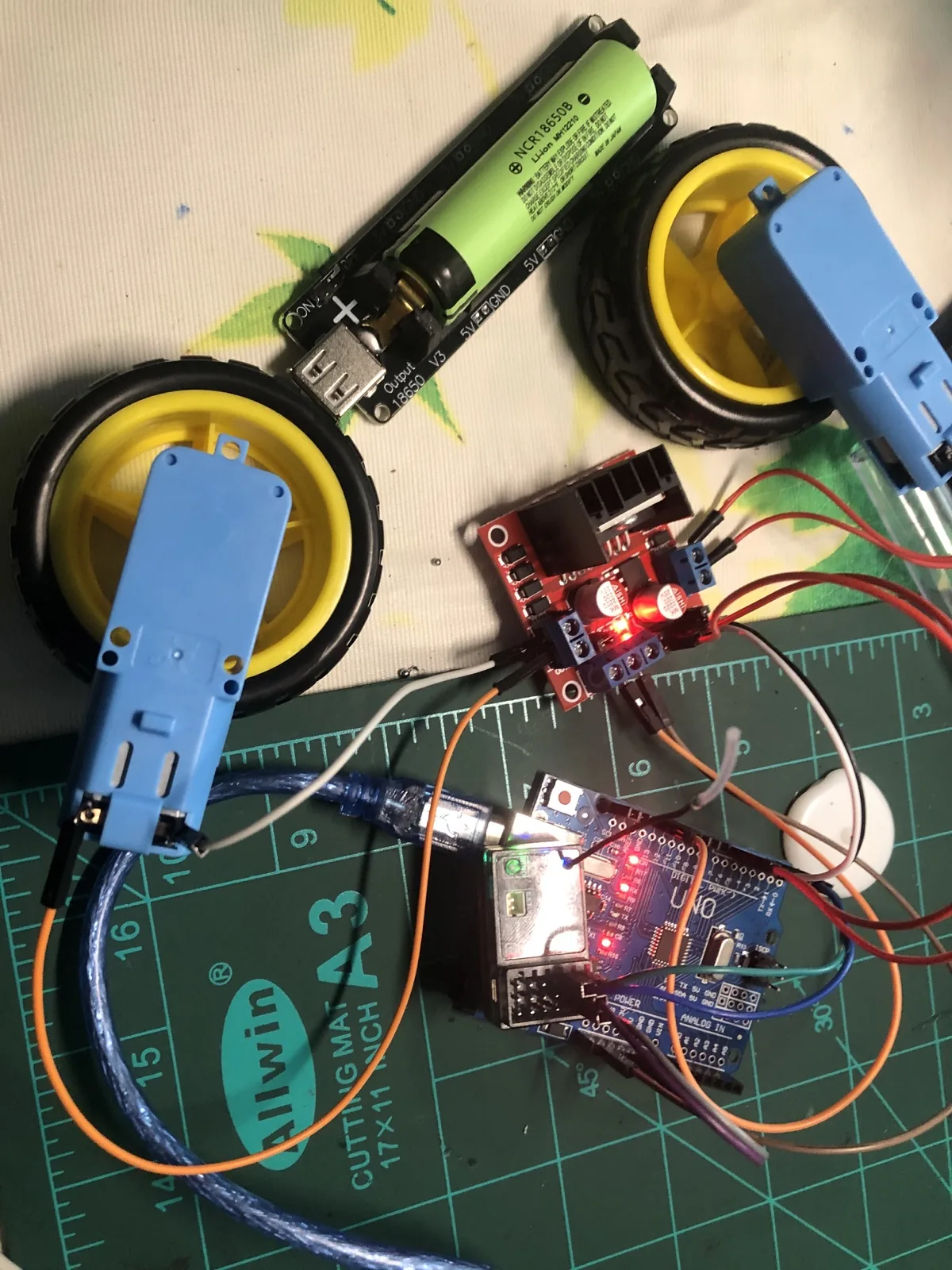 Wheels, battery, motor controller, and Arduino hardware for Miles&rsquo;s sumo bot